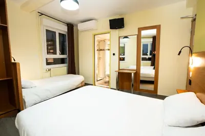 Un ou plusieurs lits dans un hébergement de l'établissement Hôtel de la Terrasse