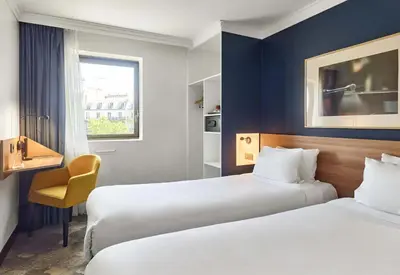 Un ou plusieurs lits dans un hébergement de l'établissement B&B HOTEL Paris 17 Batignolles
