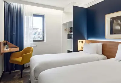 Un ou plusieurs lits dans un hébergement de l'établissement B&B HOTEL Paris 17 Batignolles