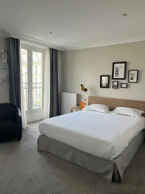 Un ou plusieurs lits dans un hébergement de l'établissement Hôtel Londres et New York - Teritoria
