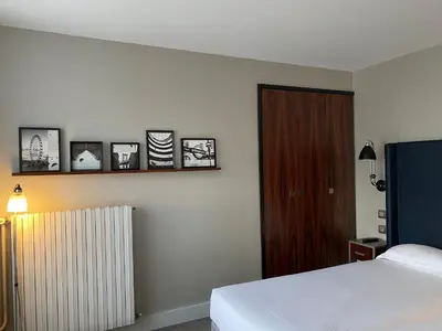 Un ou plusieurs lits dans un hébergement de l'établissement Hôtel Londres et New York - Teritoria