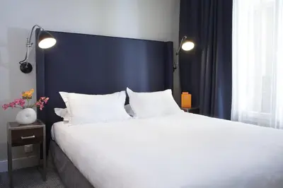 Un ou plusieurs lits dans un hébergement de l'établissement Hôtel Londres et New York - Teritoria