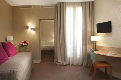 Un ou plusieurs lits dans un hébergement de l'établissement Hôtel Londres et New York - Teritoria