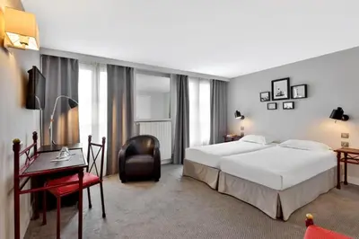 Un ou plusieurs lits dans un hébergement de l'établissement Hôtel Londres et New York - Teritoria