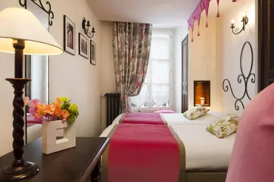 Un ou plusieurs lits dans un hébergement de l'établissement Castex Hotel