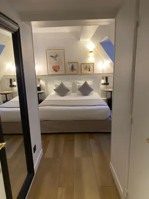 Un ou plusieurs lits dans un hébergement de l'établissement XO Hotel Paris