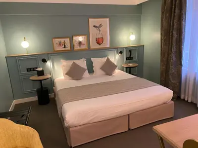 Un ou plusieurs lits dans un hébergement de l'établissement XO Hotel Paris