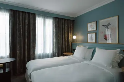 Un ou plusieurs lits dans un hébergement de l'établissement XO Hotel Paris