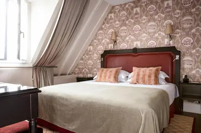 Un ou plusieurs lits dans un hébergement de l'établissement Hôtel Serotel Lutèce