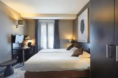 Un ou plusieurs lits dans un hébergement de l'établissement Logis hôtel Jardin de Villiers