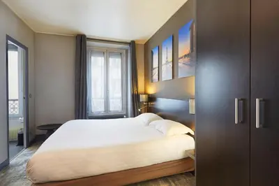 Un ou plusieurs lits dans un hébergement de l'établissement Logis hôtel Jardin de Villiers