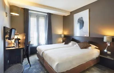 Un ou plusieurs lits dans un hébergement de l'établissement Logis hôtel Jardin de Villiers