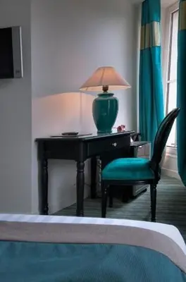 Un ou plusieurs lits dans un hébergement de l'établissement Hotel Cluny Square