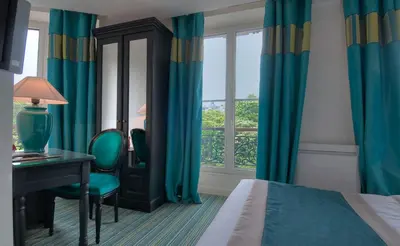 Un ou plusieurs lits dans un hébergement de l'établissement Hotel Cluny Square