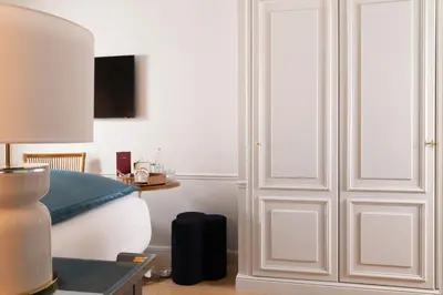 Un ou plusieurs lits dans un hébergement de l'établissement Hôtel Le Lavoisier & Spa