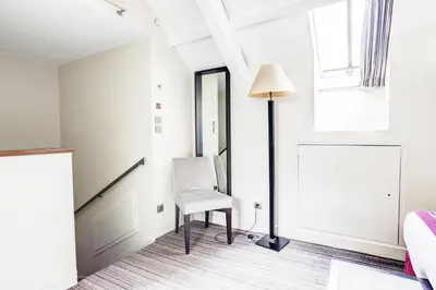 Un ou plusieurs lits dans un hébergement de l'établissement Hôtel Paris Louvre Opéra
