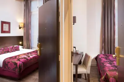 Un ou plusieurs lits dans un hébergement de l'établissement Hôtel Paris Louvre Opéra