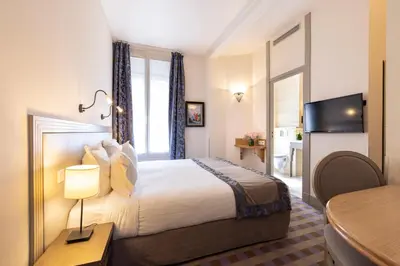 Un ou plusieurs lits dans un hébergement de l'établissement Hotel Residence Foch