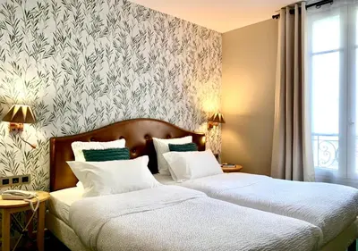 Un ou plusieurs lits dans un hébergement de l'établissement Hôtel Central Saint Germain