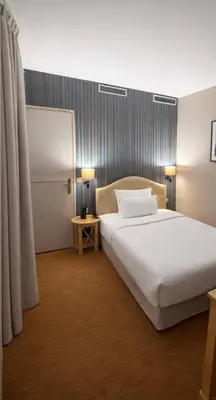 Un ou plusieurs lits dans un hébergement de l'établissement Hôtel Central Saint Germain