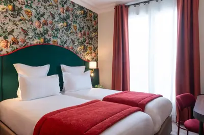 Un ou plusieurs lits dans un hébergement de l'établissement Hôtel Brittany
