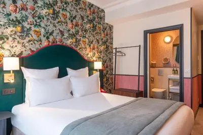 Un ou plusieurs lits dans un hébergement de l'établissement Hôtel Brittany