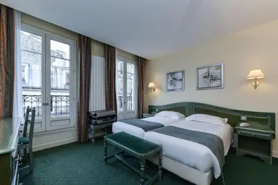 Un ou plusieurs lits dans un hébergement de l'établissement Hotel du Pré