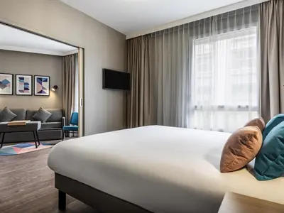 Télévision ou salle de divertissement dans l'établissement Aparthotel Adagio Paris Nation