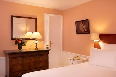 Un ou plusieurs lits dans un hébergement de l'établissement Hôtel Le Saint Gregoire