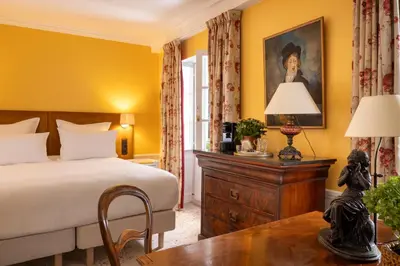 Un ou plusieurs lits dans un hébergement de l'établissement Hôtel Le Saint Gregoire
