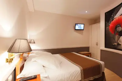 Un ou plusieurs lits dans un hébergement de l'établissement Hotel Atelier Vavin