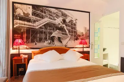Un ou plusieurs lits dans un hébergement de l'établissement Hotel Atelier Vavin