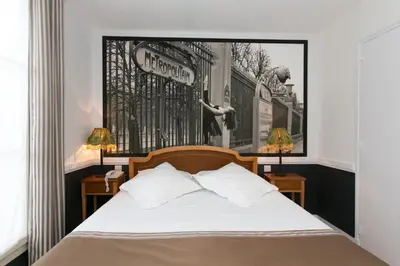 Un ou plusieurs lits dans un hébergement de l'établissement Hotel Atelier Vavin