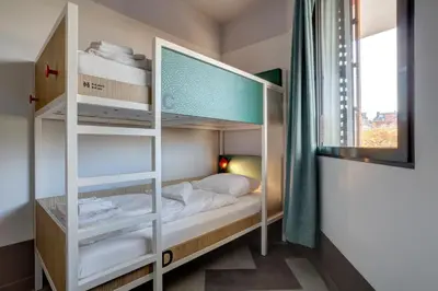 Un ou plusieurs lits dans un hébergement de l'établissement MEININGER Hotel Paris Porte de Vincennes