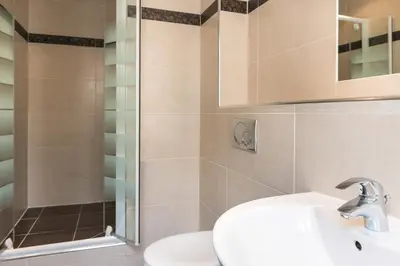 Salle de bains dans l'établissement L'Ouest Hotel