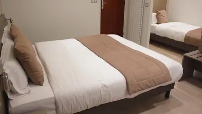 Un ou plusieurs lits dans un hébergement de l'établissement Hotel Puy De Dôme