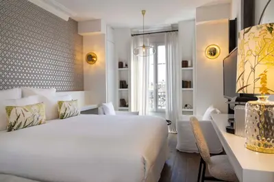 Un ou plusieurs lits dans un hébergement de l'établissement Hôtel de Banville
