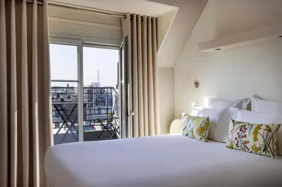 Un ou plusieurs lits dans un hébergement de l'établissement Hôtel de Banville