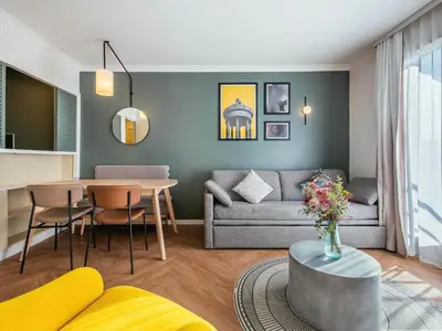 Coin salon dans l'établissement Aparthotel Adagio Paris Buttes Chaumont