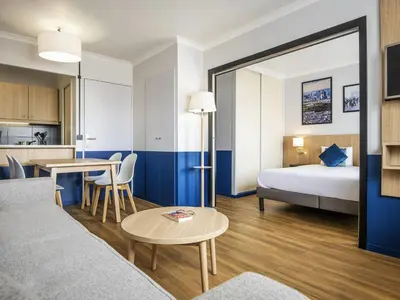 Un ou plusieurs lits dans un hébergement de l'établissement Aparthotel Adagio La Défense Kléber