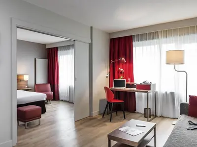 Un ou plusieurs lits dans un hébergement de l'établissement Aparthotel Adagio Paris Bercy Village