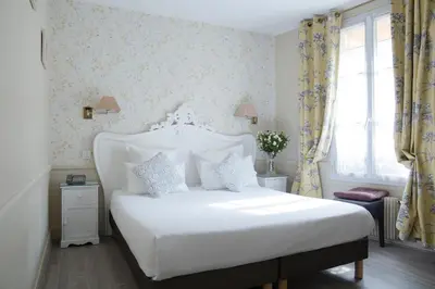 Un ou plusieurs lits dans un hébergement de l'établissement Hôtel de la Motte Picquet