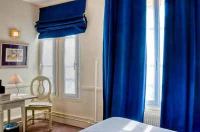 Un ou plusieurs lits dans un hébergement de l'établissement Hôtel de la Motte Picquet