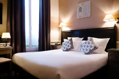 Un ou plusieurs lits dans un hébergement de l'établissement Hôtel de la Motte Picquet