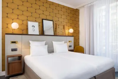 Un ou plusieurs lits dans un hébergement de l'établissement Best Western Plus La Demeure