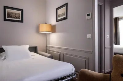 Un ou plusieurs lits dans un hébergement de l'établissement Pavillon Monceau by Happyculture