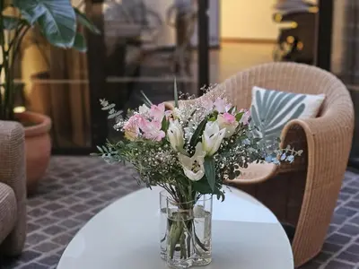 Coin salon dans l'établissement Hôtel Le Colisée