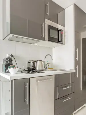 Cuisine ou kitchenette dans l'établissement Résidence Louvre - Bellan