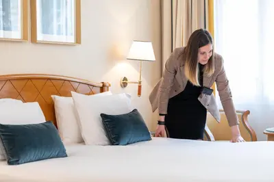 Un ou plusieurs lits dans un hébergement de l'établissement Hotel Etats Unis Opera