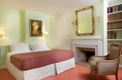 Un ou plusieurs lits dans un hébergement de l'établissement Relais Du Louvre